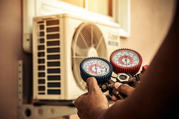 Professional Air Conditioning Service technician working in East Weymouth, MA